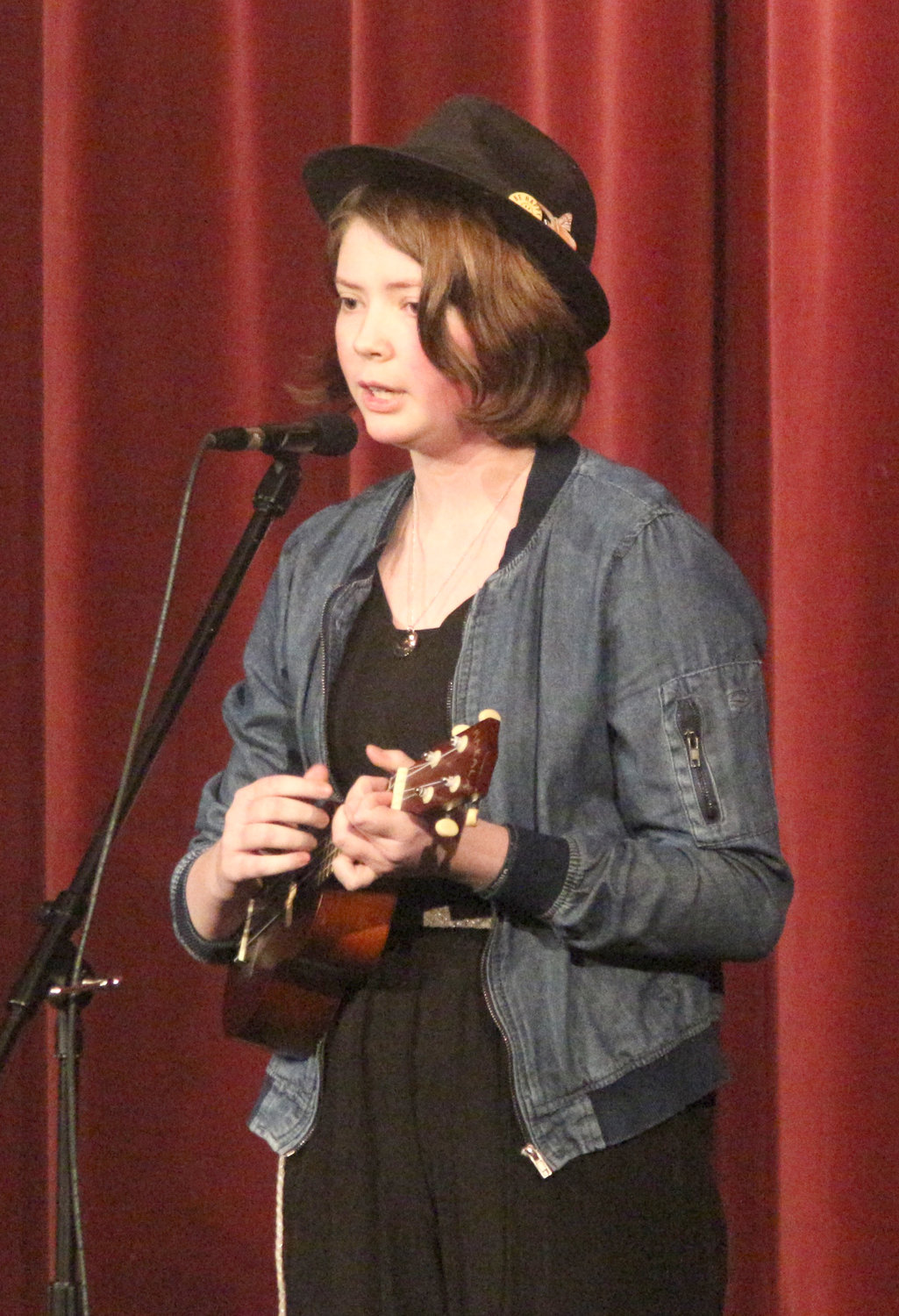Maddie O’Donnell plays her ukulele while singing “July” at the Mid-Prairie Middle School choral concert on Tuesday, Feb. 25.